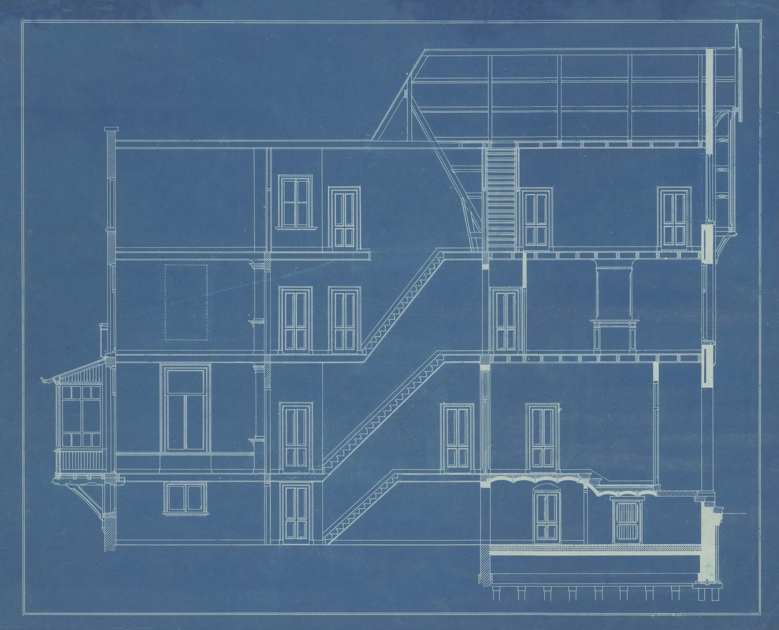 Architectural building section blueprint on a blue background