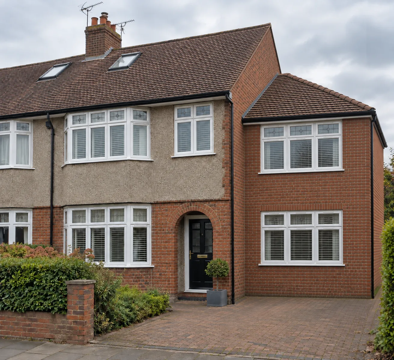 Semi-detached house with a hip to gable roof and a set-back two storey side extension with a lower hipped roof