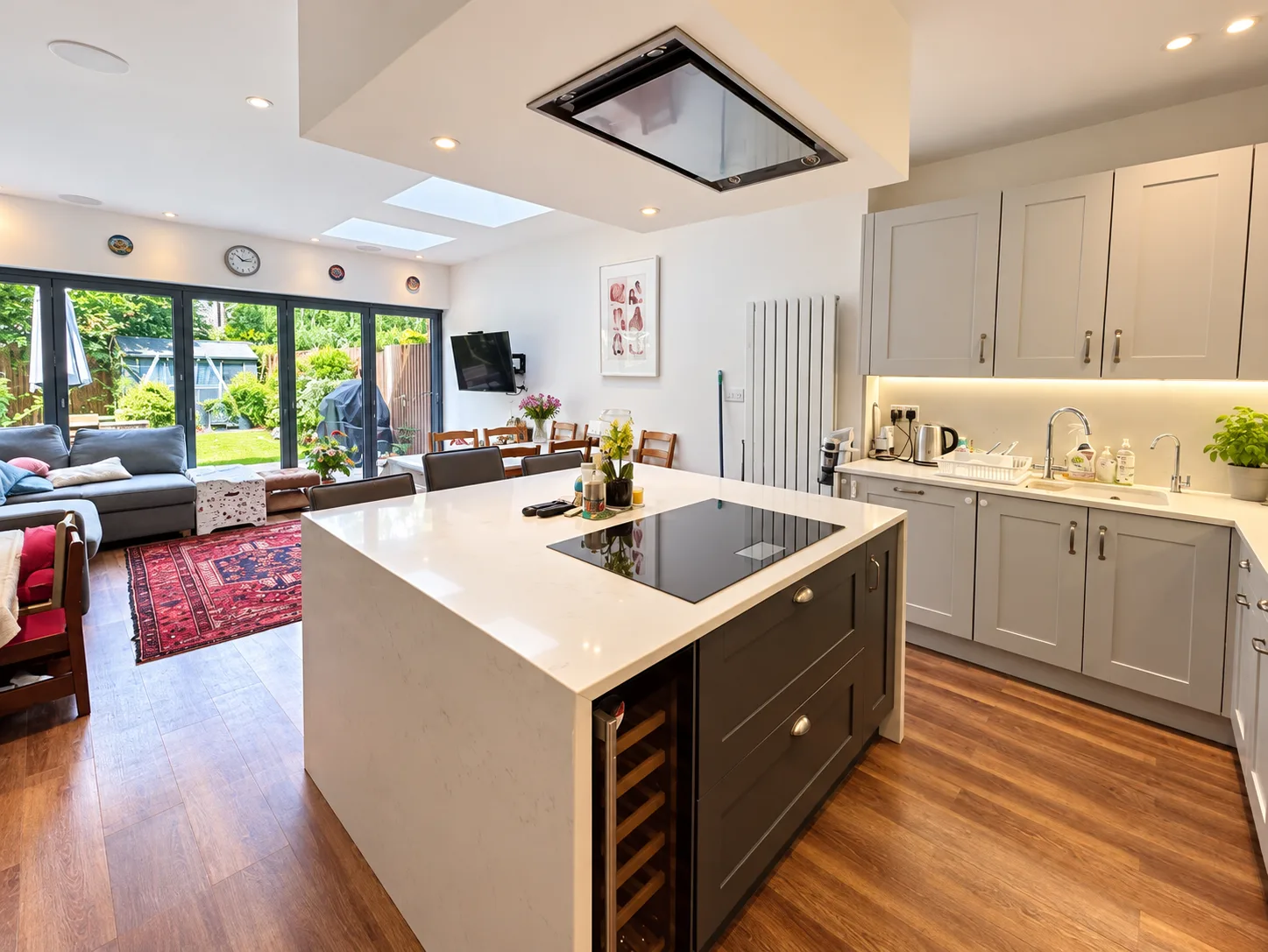 Completed Wimbledon rear extension with an open-plan kitchen and family space, rooflights and wide garden doors