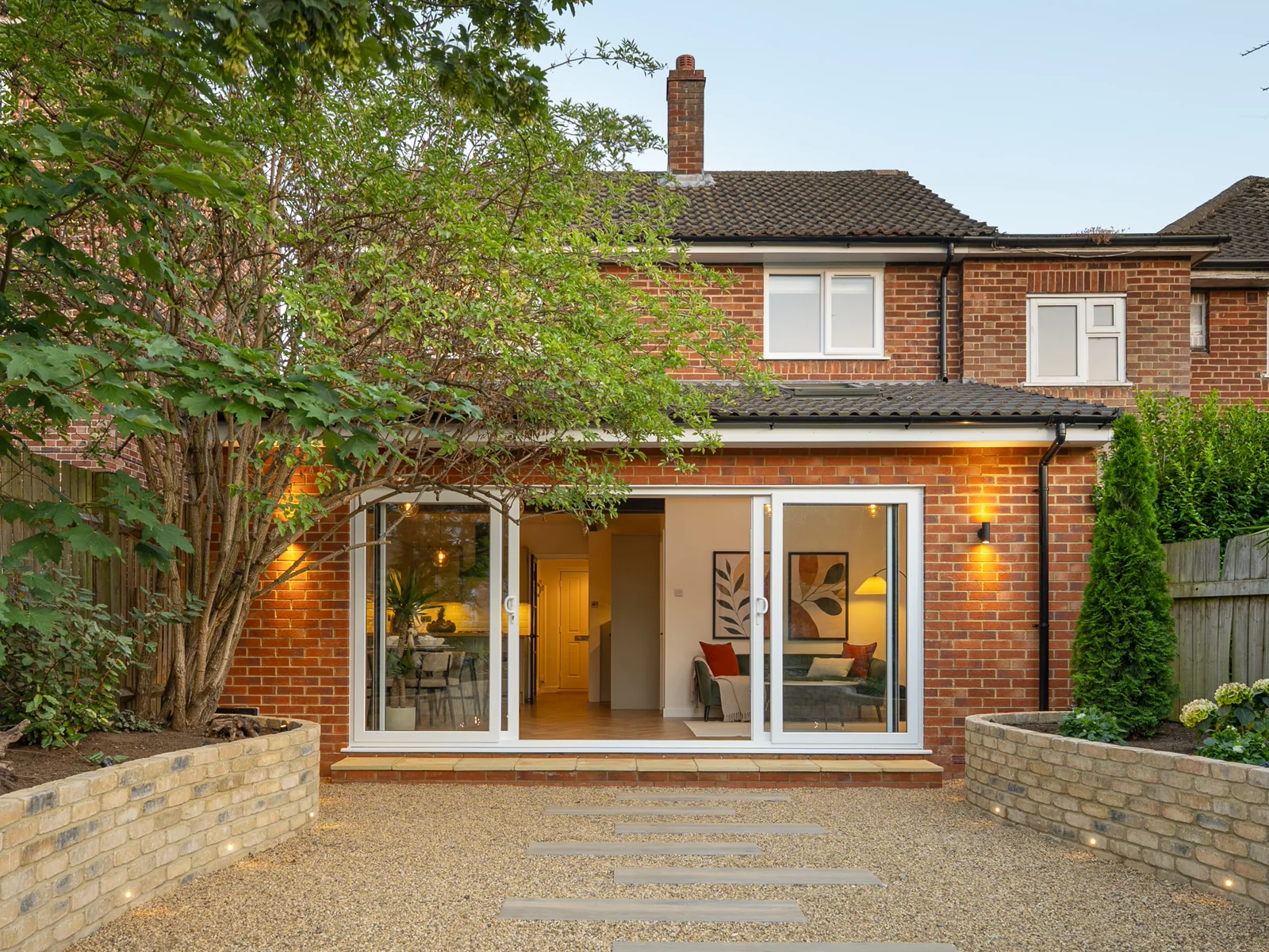 Completed Lambeth rear extension with brickwork, garden glazing and planted borders